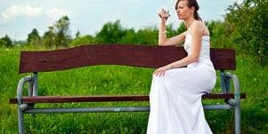 lonely woman in wedding dress