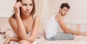 unhappy couple in bedroom