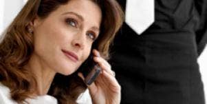 Brunette woman holding a phone