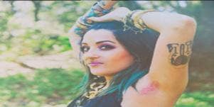 Woman with pink underarm hair.