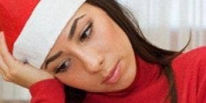 Sad woman in santa hat