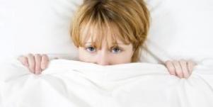 Woman under the covers