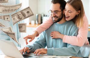 Portrait of Happy Couple Looking at Laptop