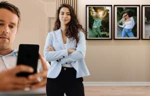 woman proudly displaying her husbands ex in frames in their hallway