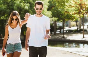 Portrait of beautiful young couple walking in the park.