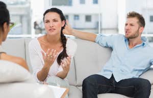 couple talking to their therapist in therapists office