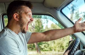 Man raging with anger behind the wheel