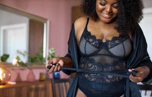 good-looking black woman wearing silk dressing gown at home
