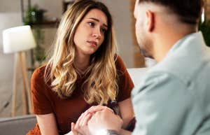 Young woman having a problem. Boyfriend comforting his sad girlfriend.