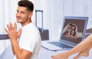 man looking mischevious on business trip with another woman in his bed and family photo on laptop