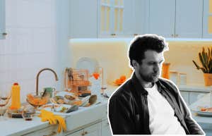 man sitting in his kitchen in the chaos he made