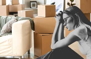 sad woman packing up apartment