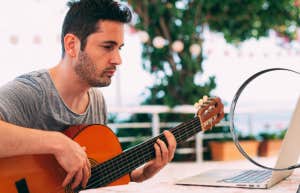 man on Facebook showing off for other woman, Facebook page under a magnifying glass in his relationship