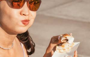 woman chewing sandwich