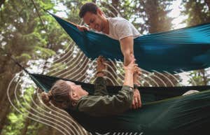 Couple hanging in hammock