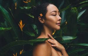 Concept, charming female with closed eyes keeping healthy lifestyle spending time in nature