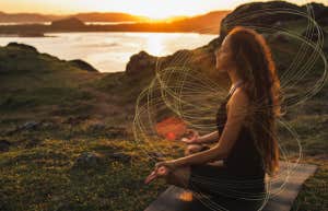 empathic woman taking a quiet moment for herself in nature