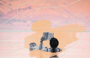 Tiny Things People Can Do To Improve Mental Health woman sitting in water, outside in nature while reading a book