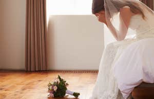 Bride In Bedroom Having Second Thoughts Before Wedding