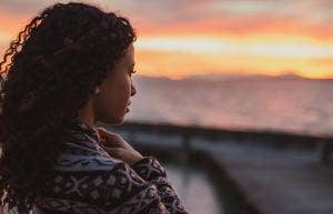 woman staring off into sunset