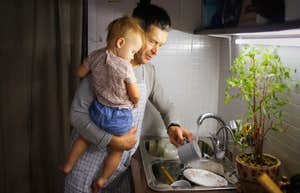 man holding son doing chores