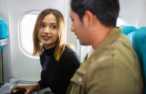 woman annoyed with fellow plane passenger