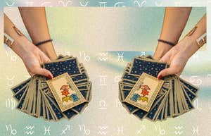 hand holding tarot cards for horoscope reading may 30