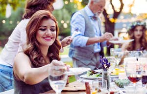 woman eating at wedding reception