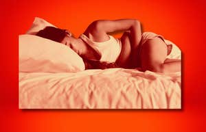 Woman curled in period pain, stage ii endometriosis