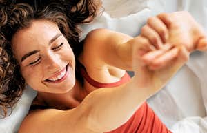 Woman stretching, feeling confident after a one night stand 