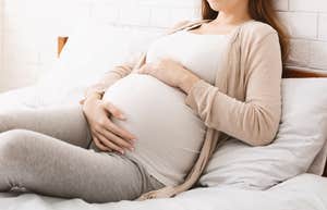 pregnant woman resting in bed