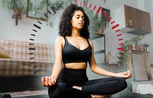 Woman meditating in her living room for 15 minutes a day