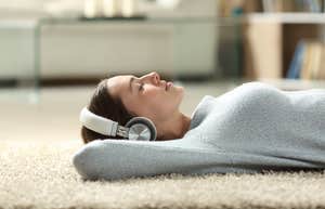 Woman listening to music to protect her brain