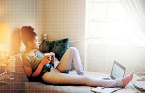 Woman having a coffee, taking a quick break to feel good