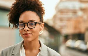 intelligent woman smiling wearing glasses