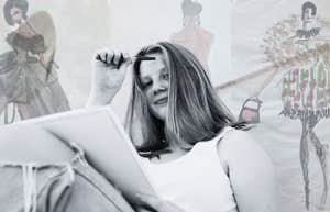 Young resilient girl in her bedroom, creatively sketching 