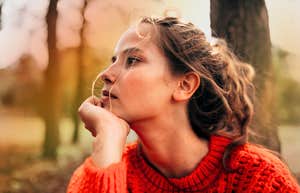 Pensive woman getting through the first days of a major crisis.