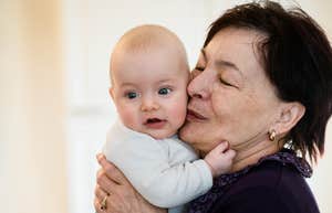 Grandma holding grandchild