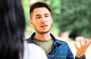 Man talking to intimidating woman