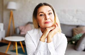 Divorced woman sitting stoically 