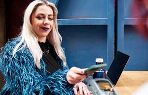 Woman paying tab while on date