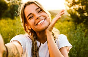 Happy woman smiling, dramatically changing life.