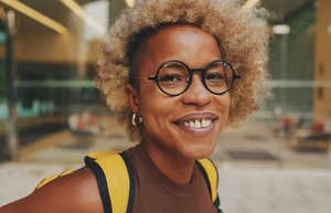 intelligent woman wearing glasses and smiling