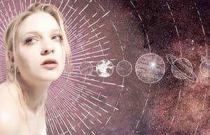 woman in universe looking at planets astrology transits bringing change november 2024