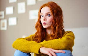 gen z young woman looking shocked