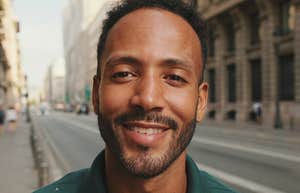 handsome smiling man on the street