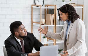 Employee being reprimanded by boss for talking about pay