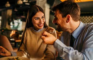 man and woman on a date eating together