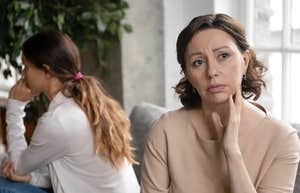 stressed older woman turned away from adult daughter