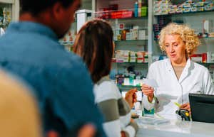 People lined up at pharmacy, stimulant epidemic.